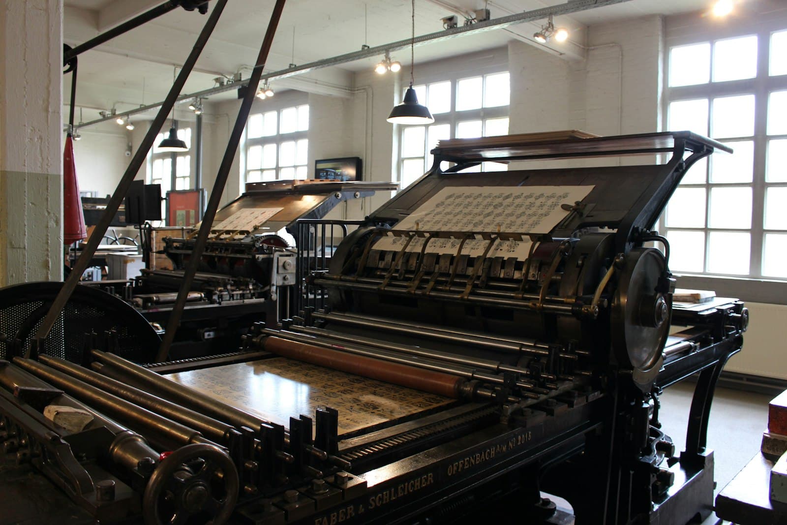 Precision printing press in a production facility